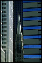 Church spire and modern buildings. Chicago, Illinois, USA