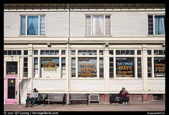 Men sitting in front of candy store, Provincetown. Cape Cod, Massachussets, USA