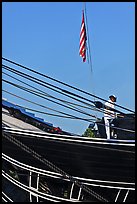 Sailor and flag on USS Constitution (9/11 10th anniversary). Boston, Massachussets, USA