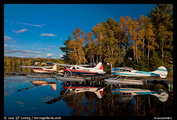 Floatplanes and reflections in Moosehead Lake  late afternoon, Greenville. Maine, USA