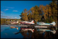 Floatplanes and reflections in Moosehead Lake  late afternoon, Greenville. Maine, USA