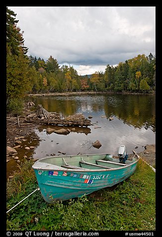 Small boat and cove, Lily Bay State Park. Maine, USA