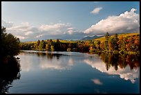 Calm Penobscot River reflects Katahdin range in the fall. Maine, USA