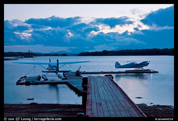 Seaplanes and dock at dusk, Ambajejus Lake. Maine, USA