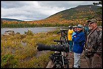 Wildlife photographers on observation platform, Sandy Stream Pond. Baxter State Park, Maine, USA (color)