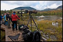 Cameras set up with telephoto lenses, Sandy Stream Pond. Baxter State Park, Maine, USA
