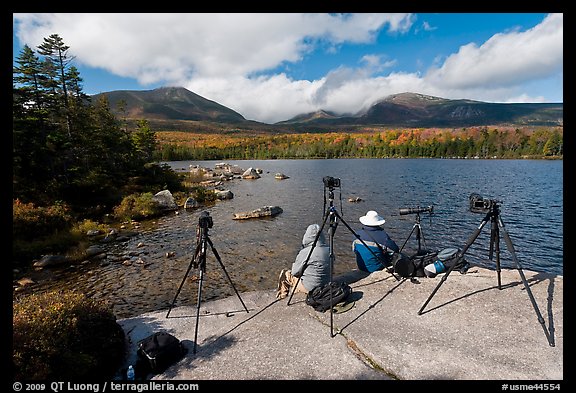 Photographers at Sandy Stream Pond waiting with cameras set up. Baxter State Park, Maine, USA