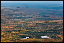 Ponds and forested landscape in autumn with spots of light. Baxter State Park, Maine, USA