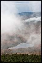 Clouds parting above Sandy Stream Pond. Baxter State Park, Maine, USA