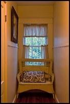 Corridor in inn with chair and window looking out to trees. Maine, USA (color)