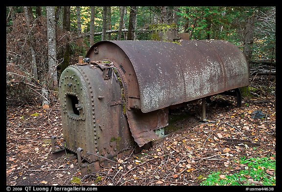 Steam engine remnant in forest. Allagash Wilderness Waterway, Maine, USA (color)