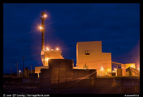 Stacks of lumber and mill at night,  Ashland. Maine, USA