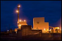 Stacks of lumber and mill at night,  Ashland. Maine, USA