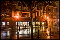 Street with wet pavement at night. Bar Harbor, Maine, USA