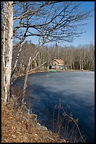 House by frozen lake. Maine, USA