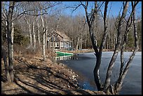 Lake, forest, and house in late winter. Maine, USA ( color)