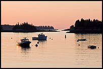 Boats and Penobscot Bay islets, sunrise. Stonington, Maine, USA