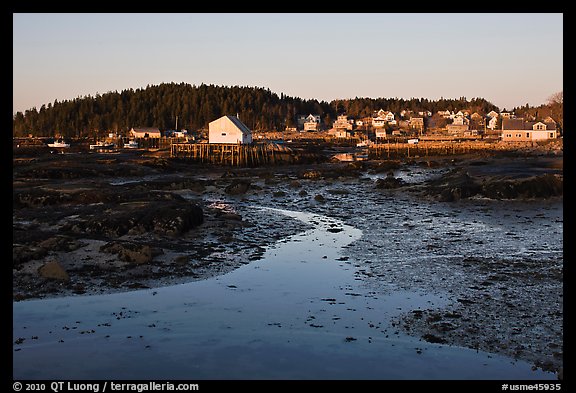 Tidal flats and houses, sunrise. Stonington, Maine, USA