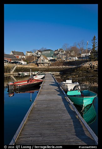 Deck, small boats, and houses. Stonington, Maine, USA (color)