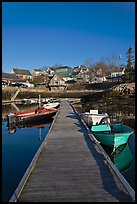 Deck, small boats, and houses. Stonington, Maine, USA (color)