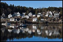 Reflection of hillside houses. Stonington, Maine, USA (color)