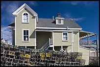 Lobster traps lined in front of house. Stonington, Maine, USA