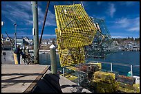 Lobsterman loading lobster traps. Stonington, Maine, USA