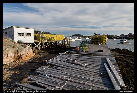 Deck, lobster traps, and harbor. Corea, Maine, USA (color)