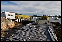 Deck, lobster traps, and harbor. Corea, Maine, USA