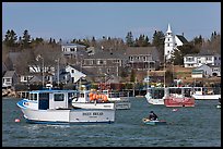 Lobsterman paddling towards boat. Corea, Maine, USA (color)