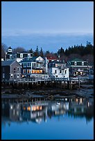 Houses with lights reflected in harbor. Stonington, Maine, USA (color)