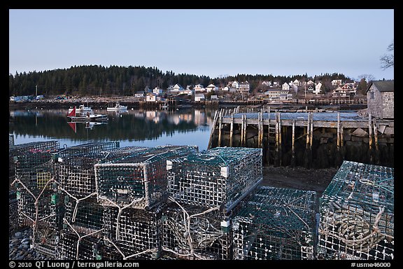 Lobster traps, pier, and village at dawn. Stonington, Maine, USA