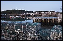 Lobster traps, pier, and village at dawn. Stonington, Maine, USA