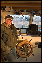 Captain of Isle-au-Haut mailboat aboard boat. Isle Au Haut, Maine, USA (color)