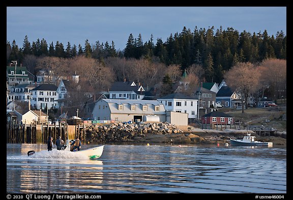 Men on small boat in harbor. Stonington, Maine, USA (color)