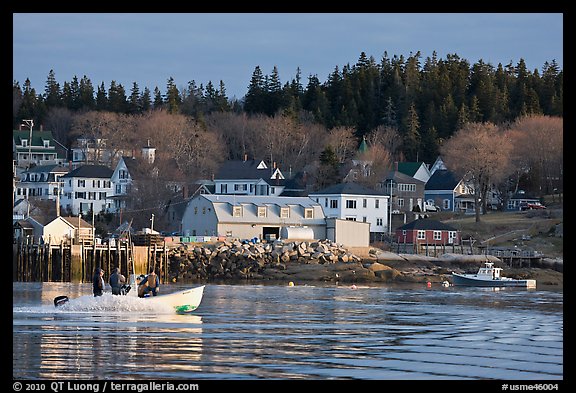 Men on small boat in harbor. Stonington, Maine, USA