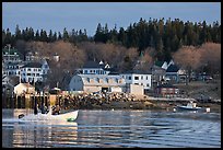 Men on small boat in harbor. Stonington, Maine, USA