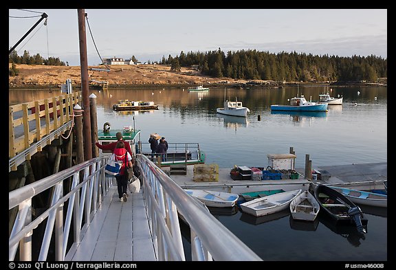 Passengers headed towards mailboat. Isle Au Haut, Maine, USA (color)