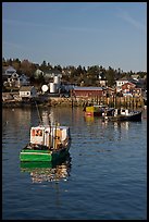 Traditional lobster boats and houses, late afternoon. Stonington, Maine, USA (color)