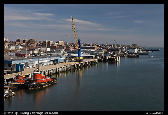 Shipping harbor with tugboats and crane. Portland, Maine, USA