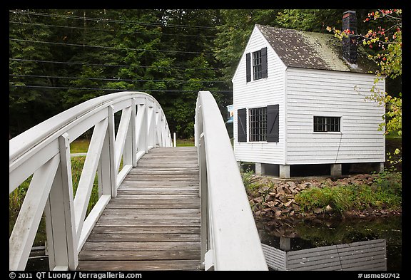 Wooden arched footbridge and house. Maine, USA (color)