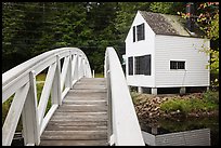 Wooden arched footbridge and house. Maine, USA (color)