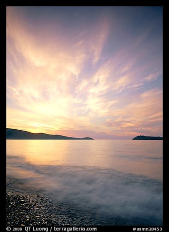 Clouds, surf, and islands near Grand Portage, sunrise. Minnesota, USA