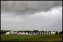 Storm clouds over grain silos. North Dakota, USA (color)