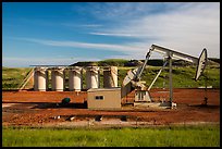 Pumping unit and tanks, oil well. North Dakota, USA (color)