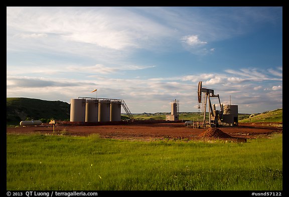 Oil pumpjack and tanks. North Dakota, USA