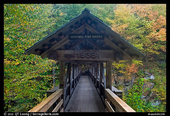 Covered footbridge in autumn, Franconia Notch State Park. New Hampshire, USA