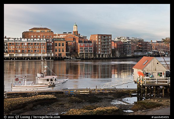 Fishing boat, shack, and waterfront buildings. Portsmouth, New Hampshire, USA