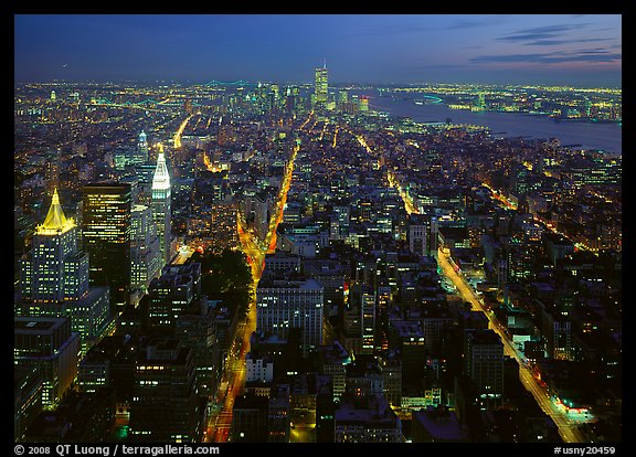 Streets at night from above with twin towers in background. NYC, New York, USA