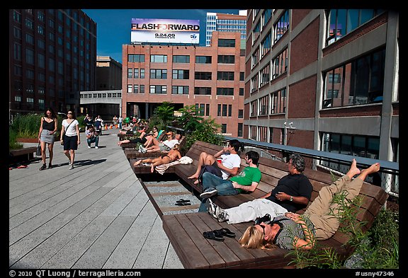 People sunning themselves on the High Line. NYC, New York, USA